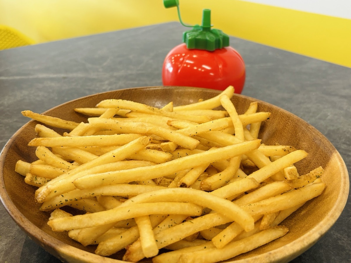 Shoestring fries in a wooden bowl