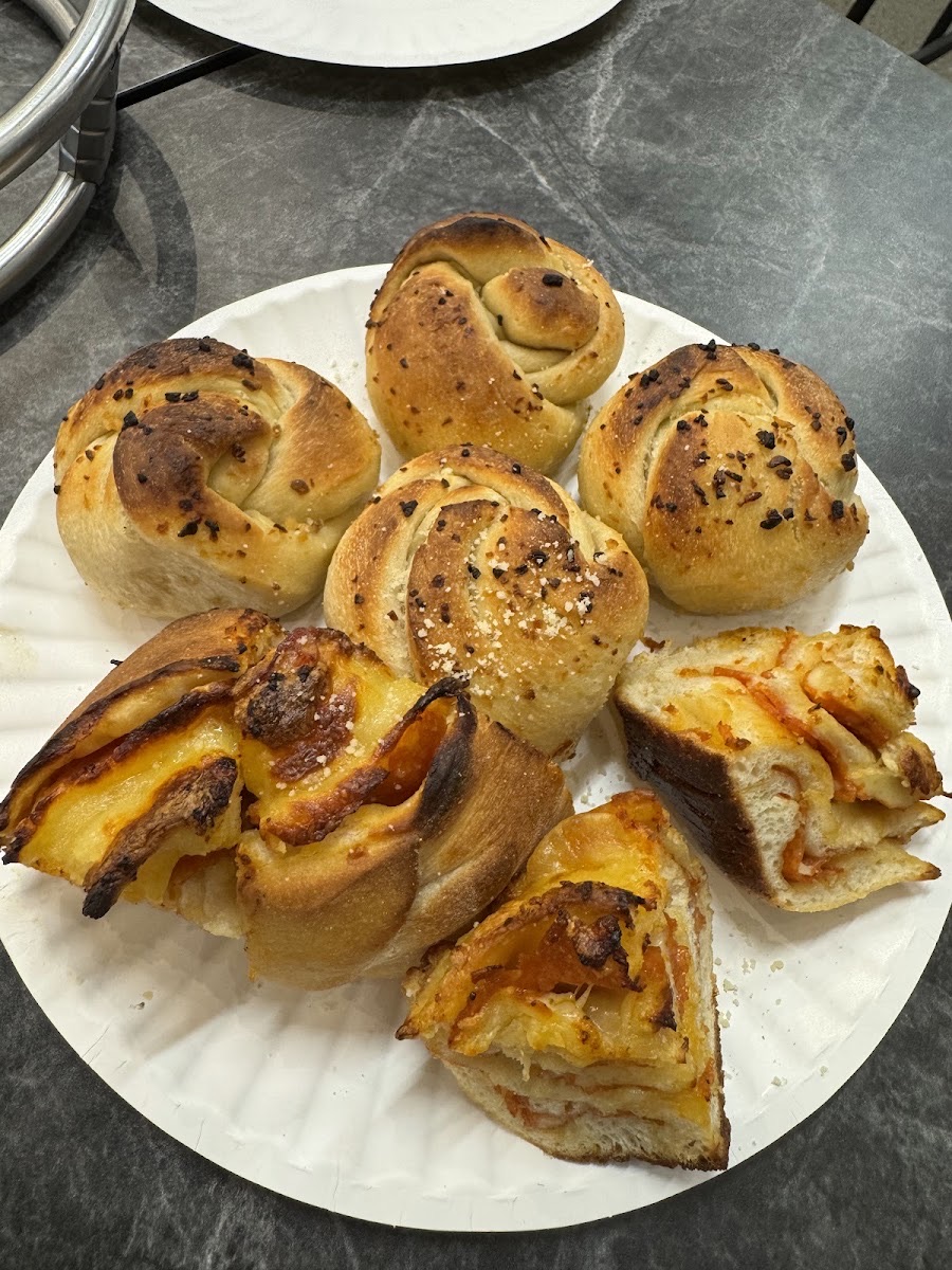 Garlic knots and pinwheels on a plate